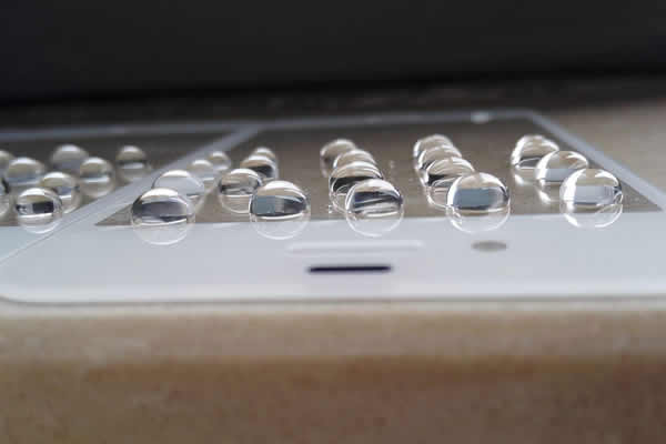 Glass finger-proof film for mobile phone